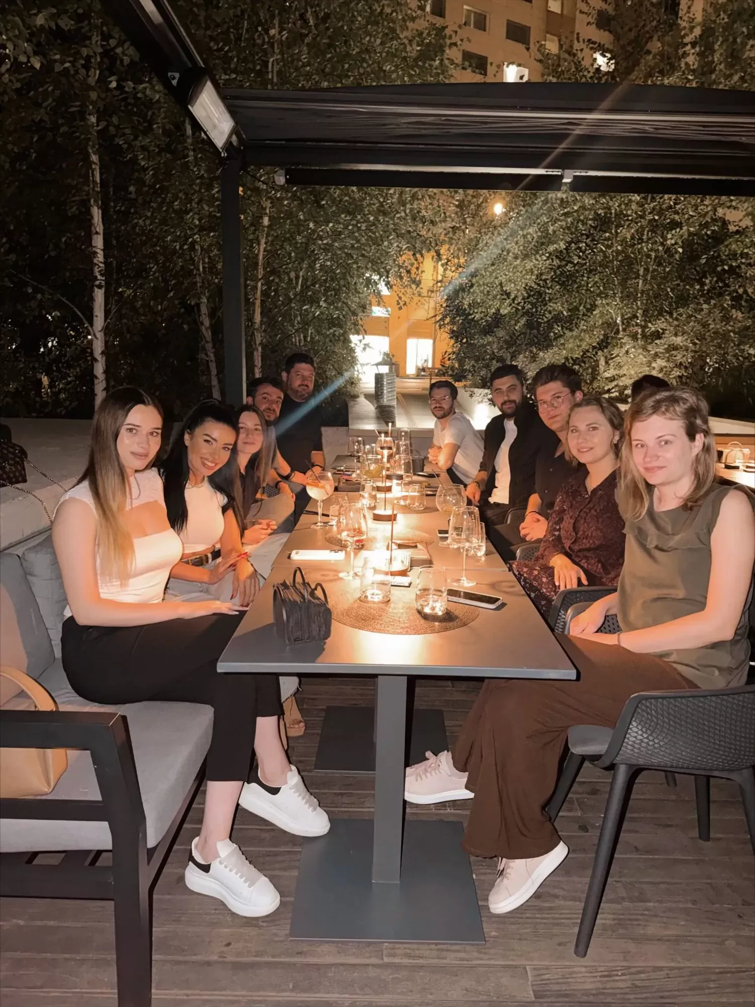 The BigConvert team at a team dinner on a terrace