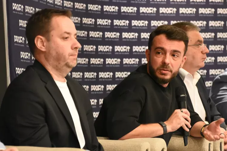 Ovidiu Golea, BigConvert co-founder, on a panel at a business conference