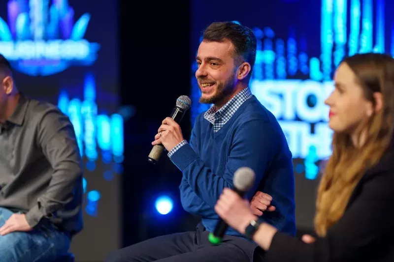 Ovidiu Golea, BigConvert co-founder, speaking on stage at a business event